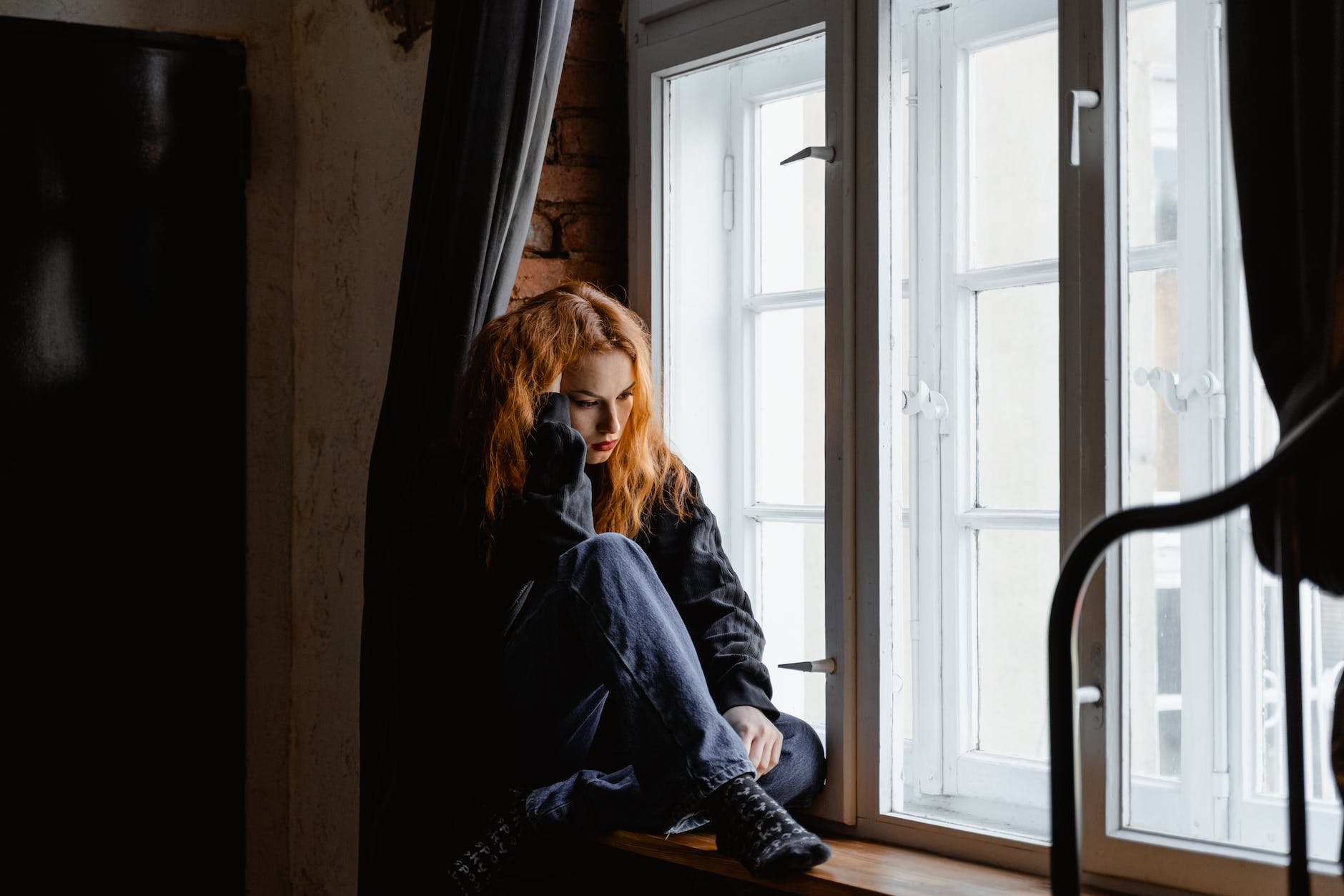 woman in black leather jacket sitting on brown wooden floor | I am seriously, When I tell you I’m a Poet