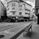 deserted urban street with architecture: Confronting the "Silent Spectator Syndrome" in a World Demanding Action.