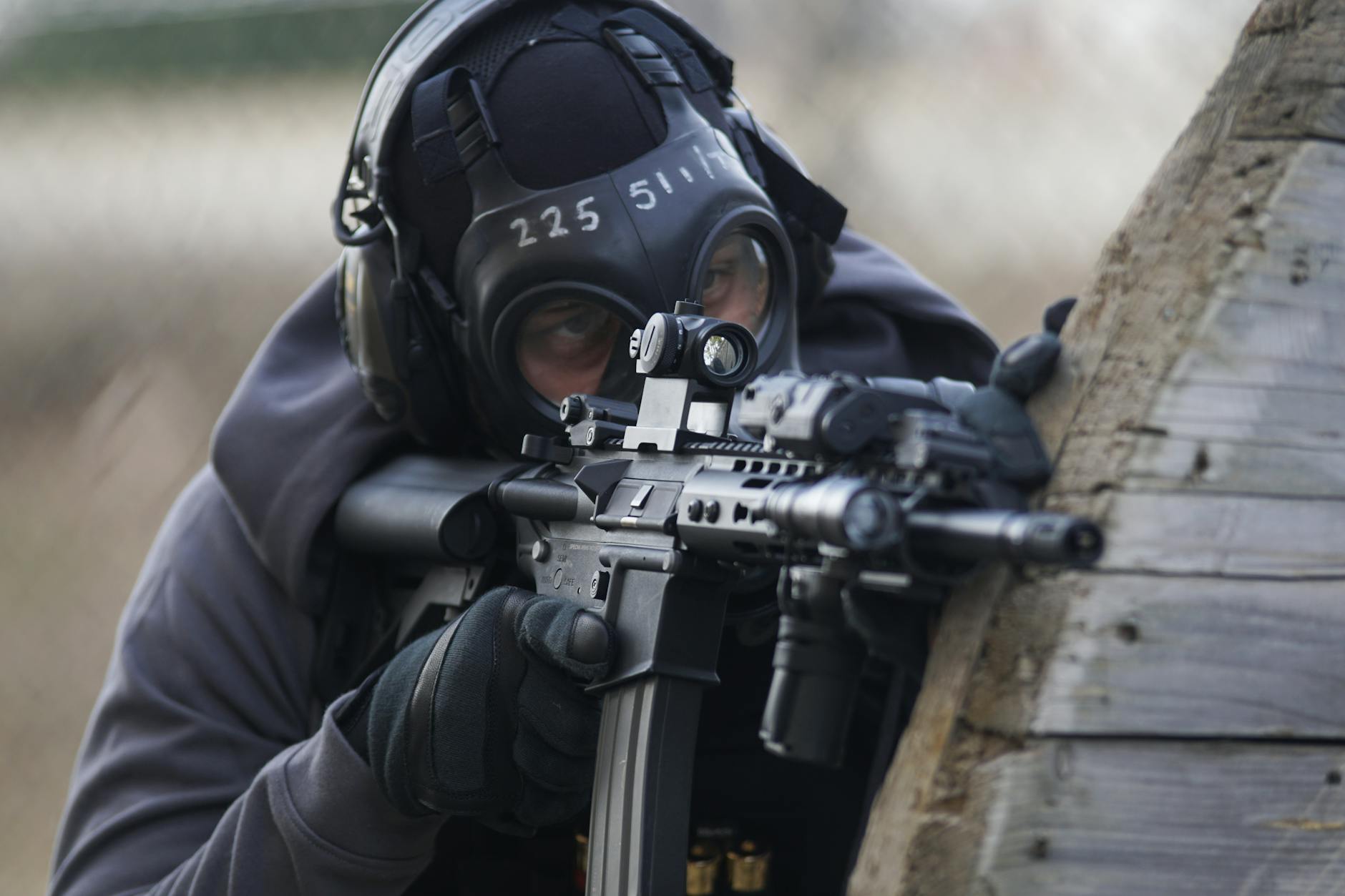 person holding airsoft gun in shallow focus lens: A powerful call for zero tolerance against terrorism—urging global unity, strategic action, and diplomacy to combat extremism and ensure peaceful coexistence.