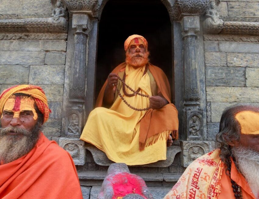 men in traditional clothing and face paint during ceremony: Learn what I discovered about the power of chanting or deep breathing 108 times. Uncover the significance of this ancient practice, how it can awaken your Ajna chakra, and shift your vibration for profound clarity and focus.