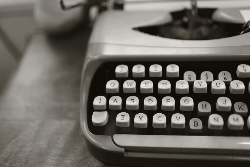 close up photo of gray typewriter: Explore the surge in content roles across industries and why skilled writers, UX pros, and strategists are more in demand than ever. Your words still matter.