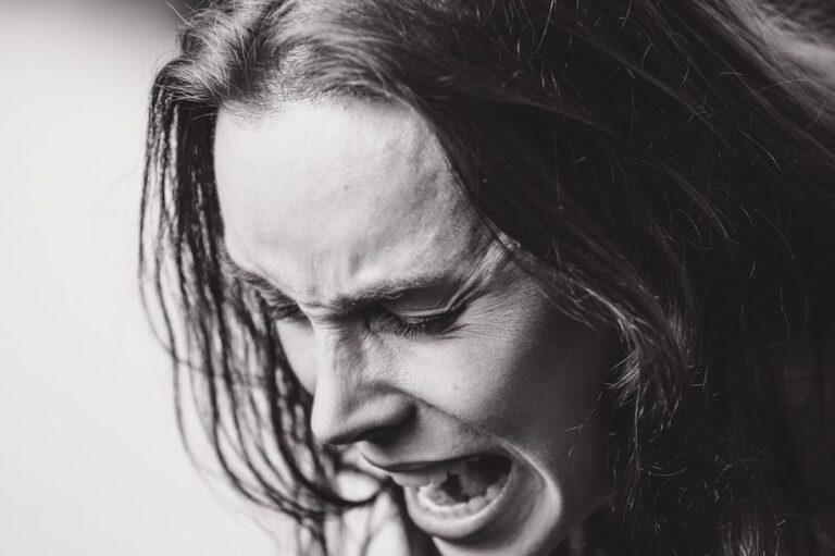 dramatic black and white emotional expression portrait: This essay explores effective anger management techniques and the rising impact of digital disorders. It discusses causes, symptoms, and evidence-based strategies for emotional regulation, along with practical solutions for overcoming smartphone and internet addiction to promote mental well-being.