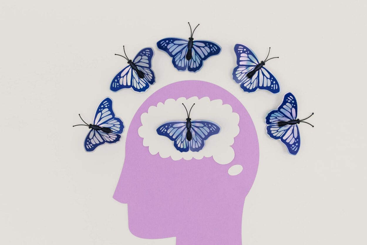 illustration of a head and butterflies around the scalp and inside the brain: Explore the vital role of human brain banks in advancing neuroscience. Learn how donated brain tissues support research on neurological disorders, promote public awareness, and pave the way for innovative treatments and diagnostics.